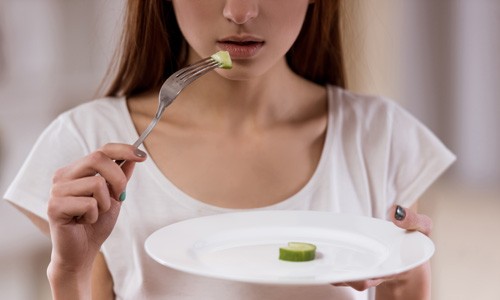 girl-eating-cucumber-500.jpg